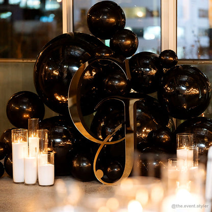 Black balloon number six candlelight birthday party table decor