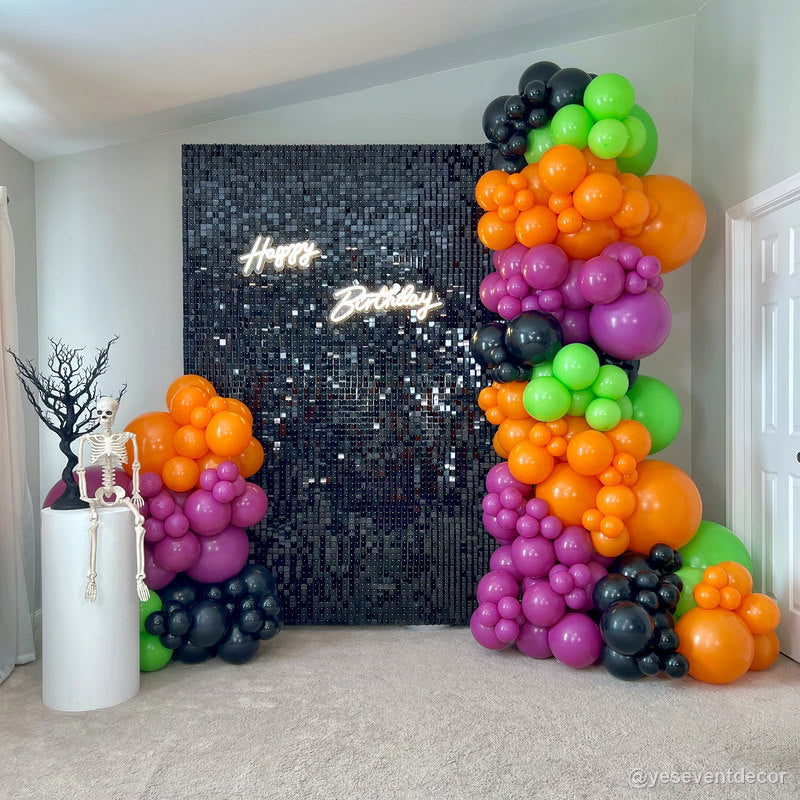 Black sequin wall orange green purple balloons halloween birthday display