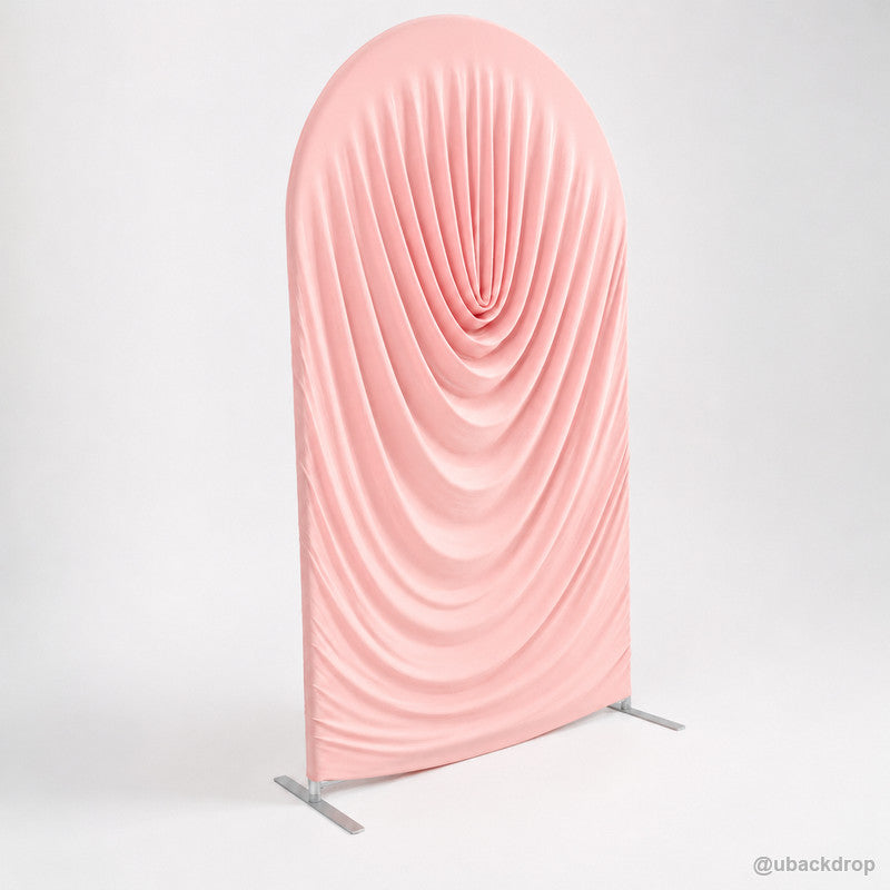 Blush pink cowl draped round arch backdrop cover left angled view