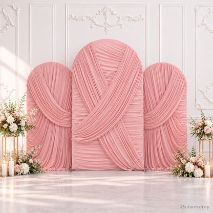 Blush pink crossed pleated fabric triple arch party backdrop