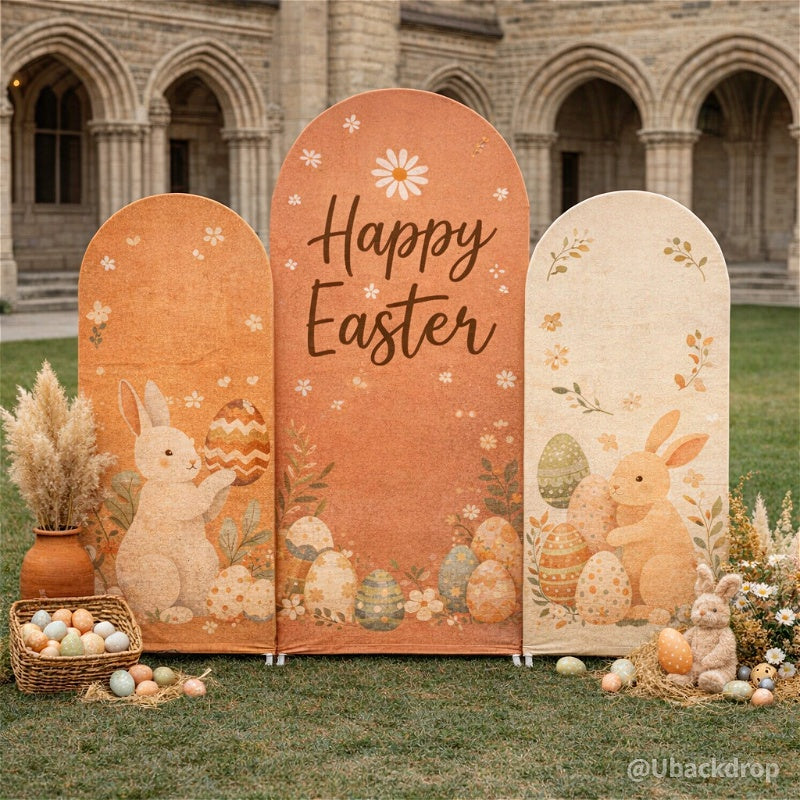 Chiara arched Easter backdrop set. Three fabric panels: orange with bunnies, eggs, and "Happy Easter" text.