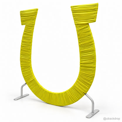 Bright yellow ruched fabric u shaped event backdrop arch angled view