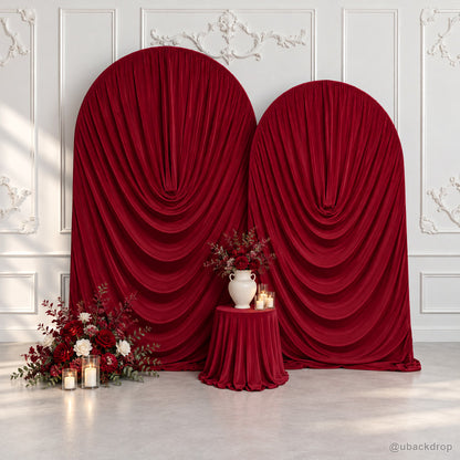 Burgundy cowl draped fabric double arch wedding backdrop