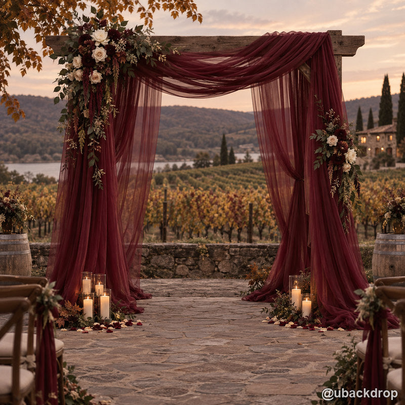 Burgundy drapery wedding party stand vineyard sunset backdrop