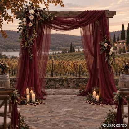 Burgundy drapery wedding party stand vineyard sunset backdrop