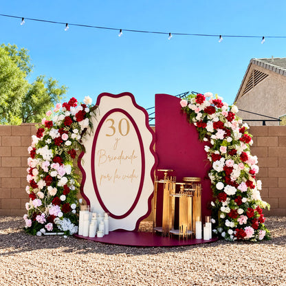 Burgundy thirtieth birthday floral backdrop garden party display