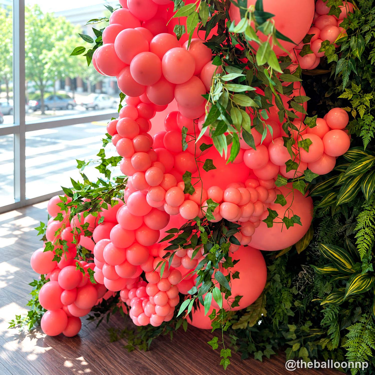 Coral balloon green flower wall detail event decoration