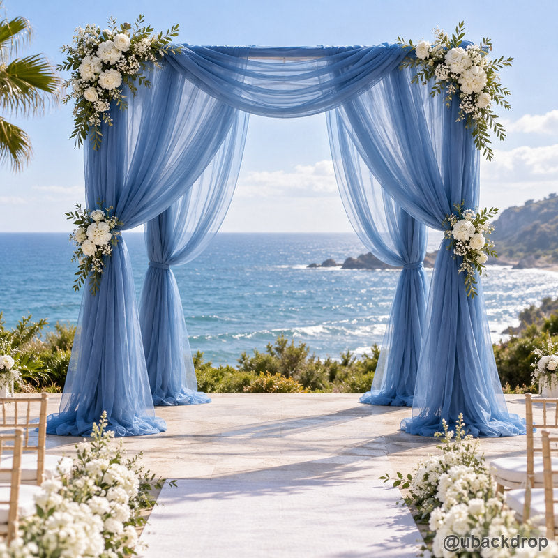 Dusty blue drapery wedding party stand ocean ceremony backdrop