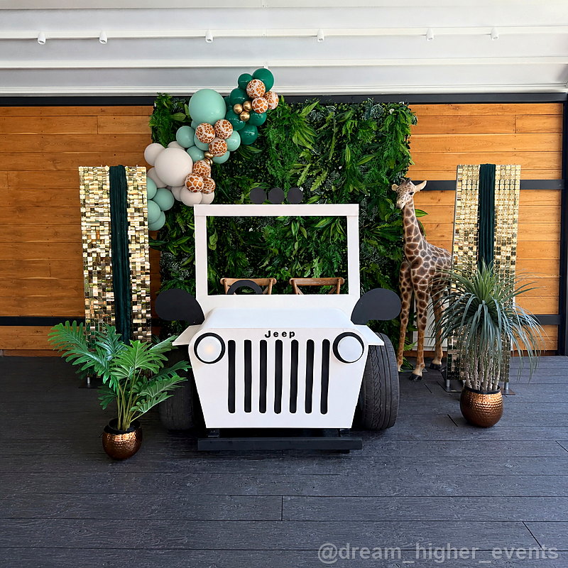 Green balloon jeep photo booth party backdrop