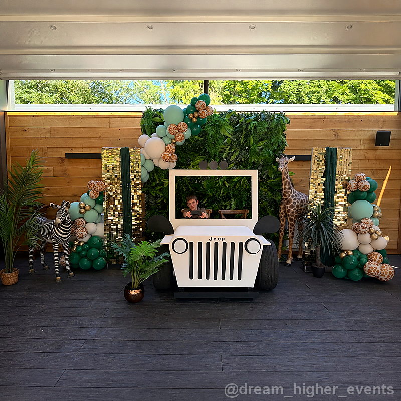 Green balloon jeep photo booth wide event backdrop