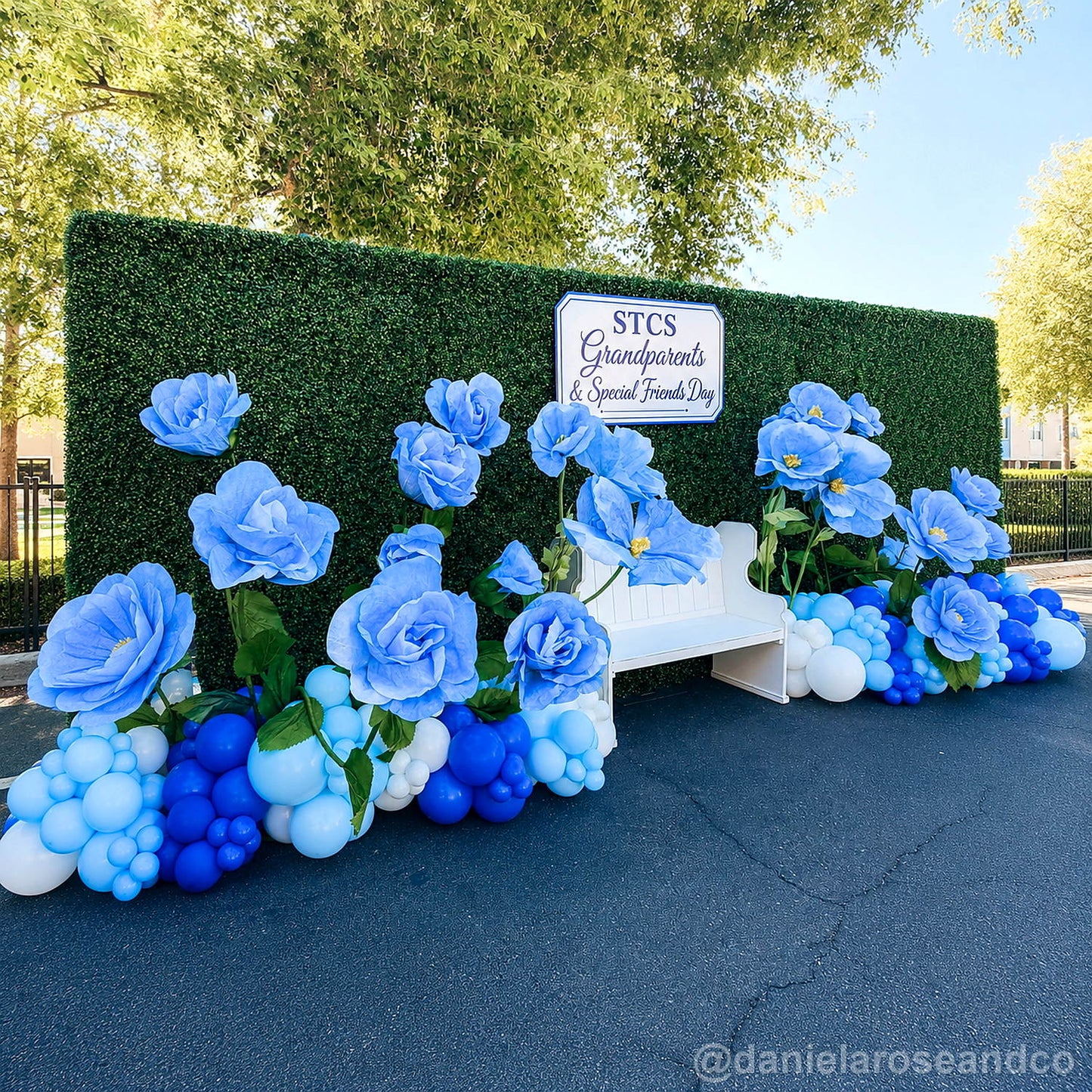 Green flower wall blue rose bench party backdrop