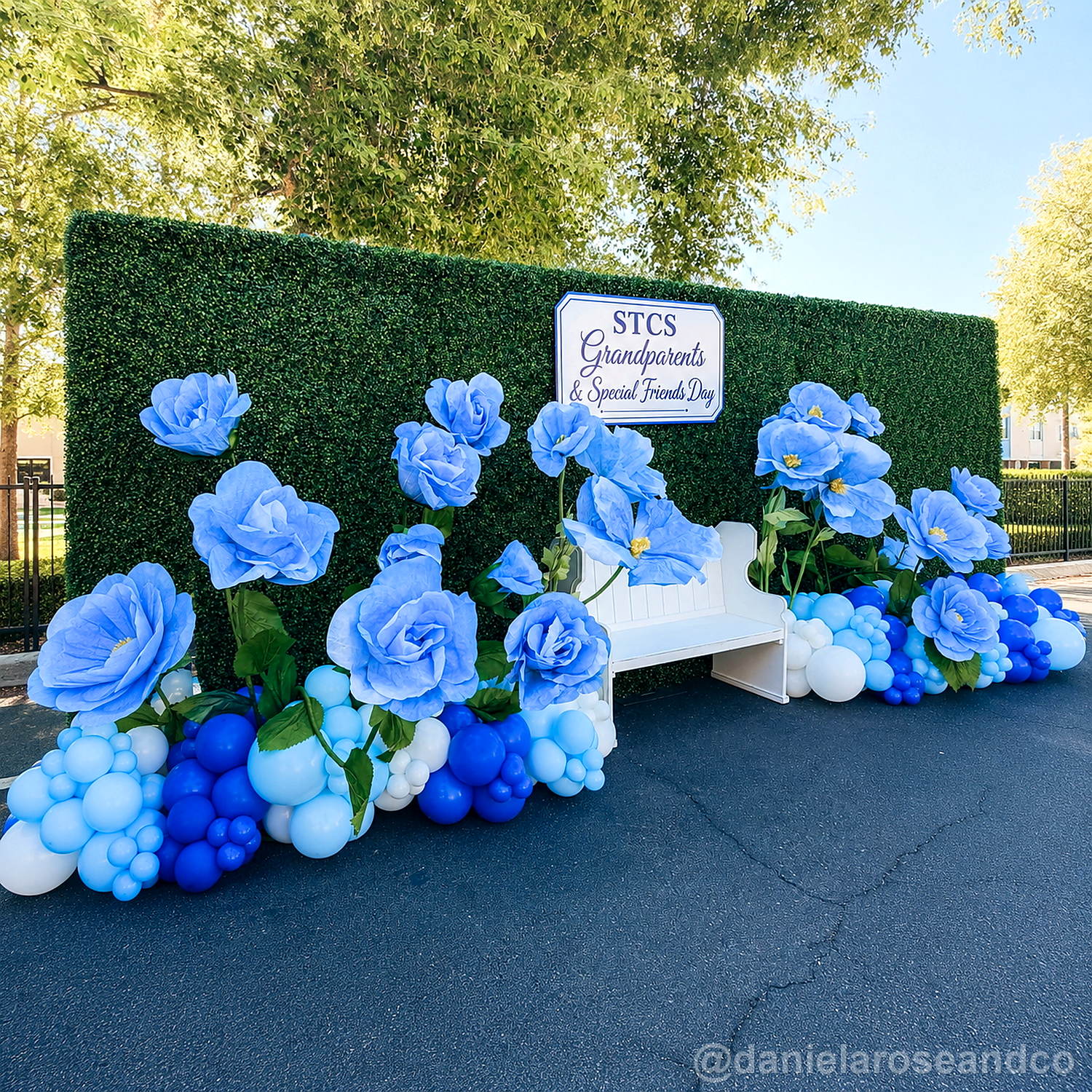 Green flower wall blue rose bench party backdrop