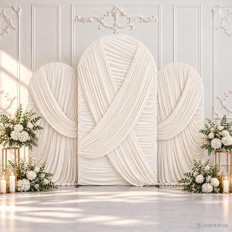 Ivory crossed pleated fabric triple arch wedding backdrop