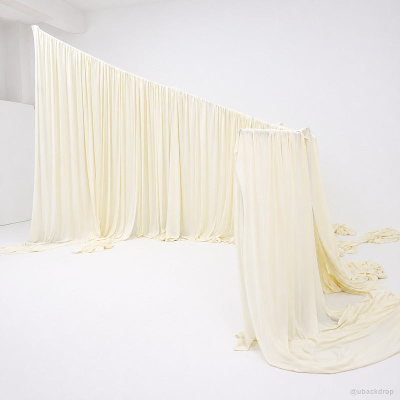 Ivory curved corner drapery wall wedding event backdrop