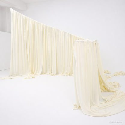 Ivory curved corner drapery wall wedding event backdrop