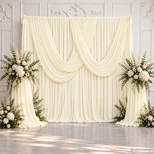 Ivory layered swag drape wedding backdrop with floral stands display