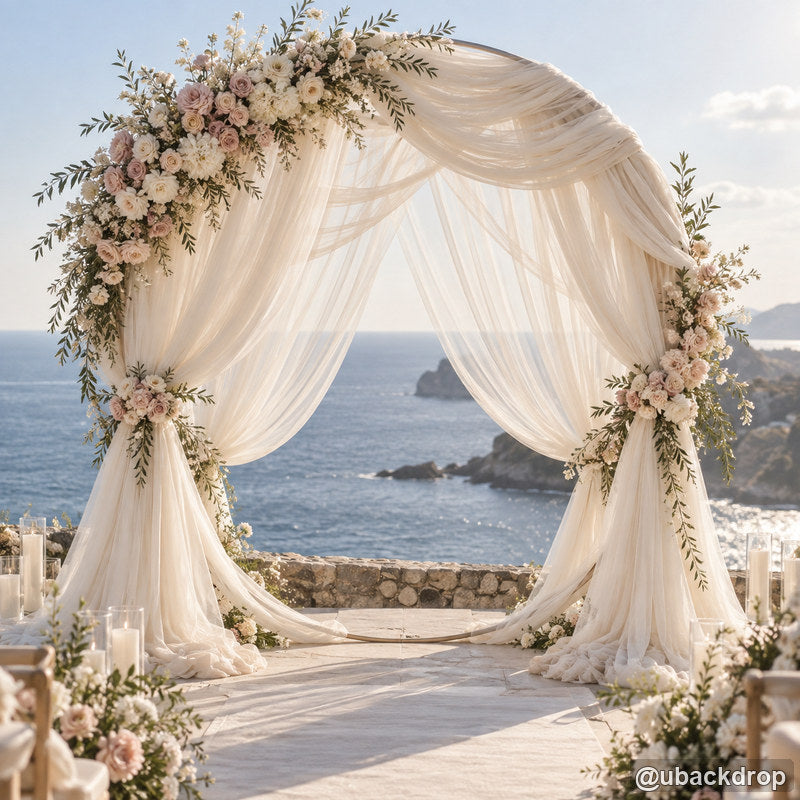 Ivory round drapery wedding arch floral seaside ceremony party stand