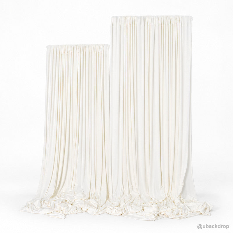 Ivory white draped double panel backdrop on t stands front view
