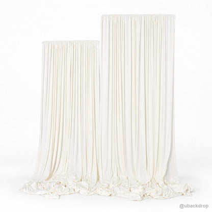 Ivory white draped double panel backdrop on t stands front view