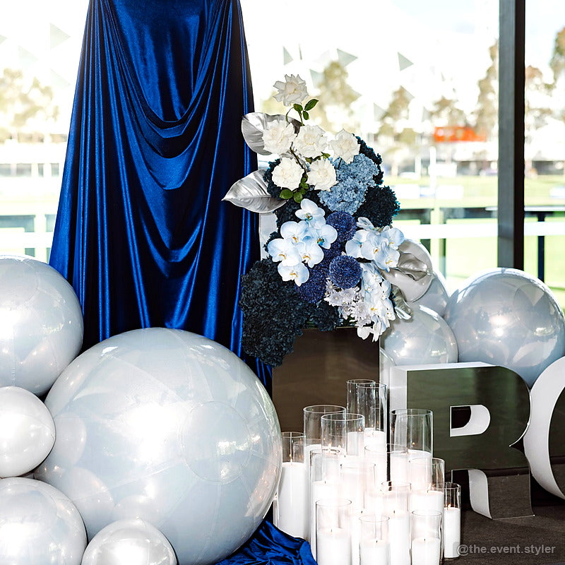 Navy blue draped party stand balloon event backdrop display