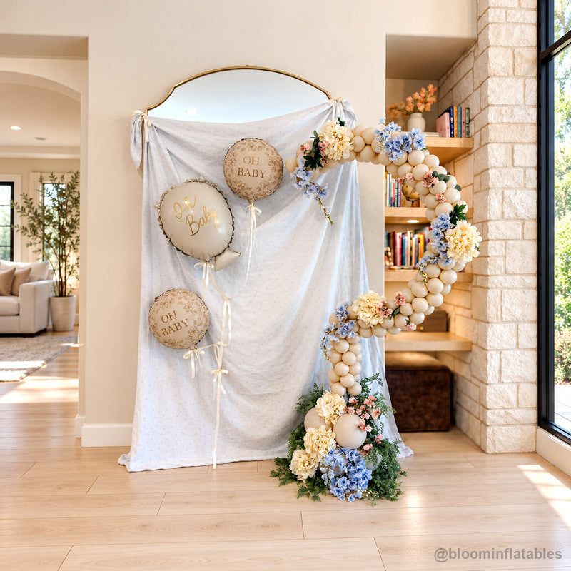 Neutral baby shower draped backdrop floral balloon garland display