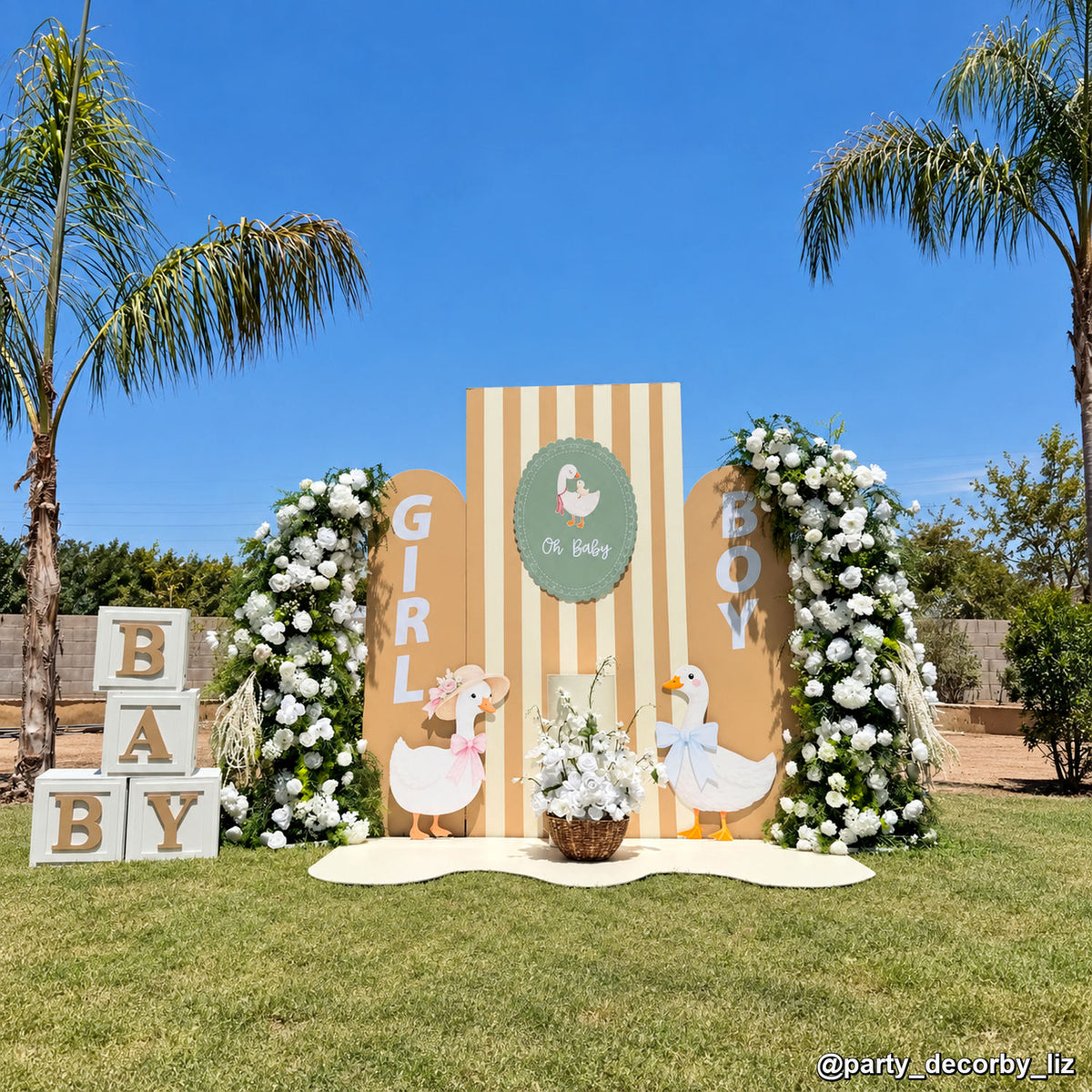 Neutral baby shower floral backdrop duck themed balloon arch garden event display