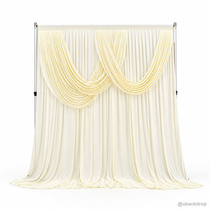 Pale yellow double swag draped backdrop front product view