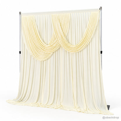 Pale yellow double swag draped backdrop right angle view