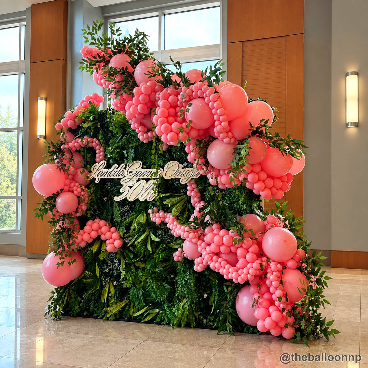Pink balloon greenery flower wall luxury event backdrop