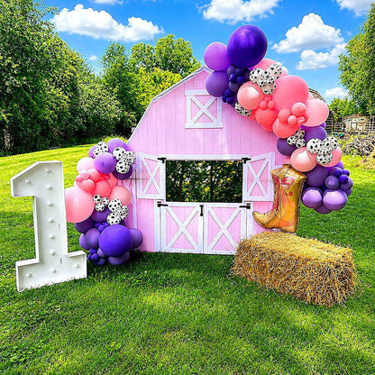 Pink barn balloon first birthday outdoor party photo backdrop