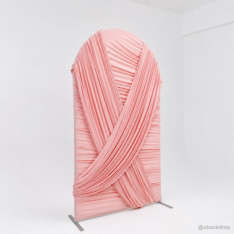 Pink crossed drapery arch party stand angled side view