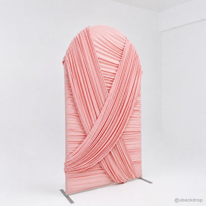 Pink crossed drapery arch party stand angled side view