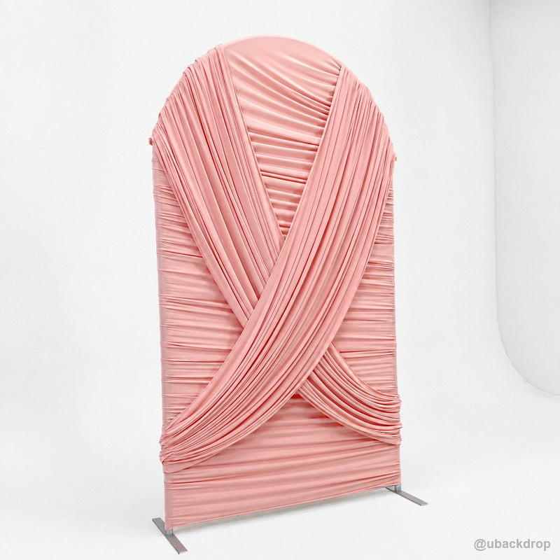 Pink crossed drapery arch party stand left side view