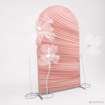 Pink horizontal ruched arch flower party stand angled view