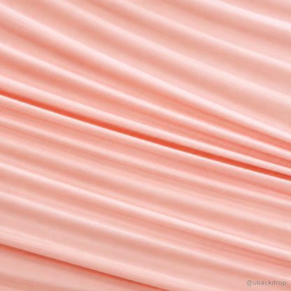 Pink horizontal ruched fabric party backdrop closeup texture detail