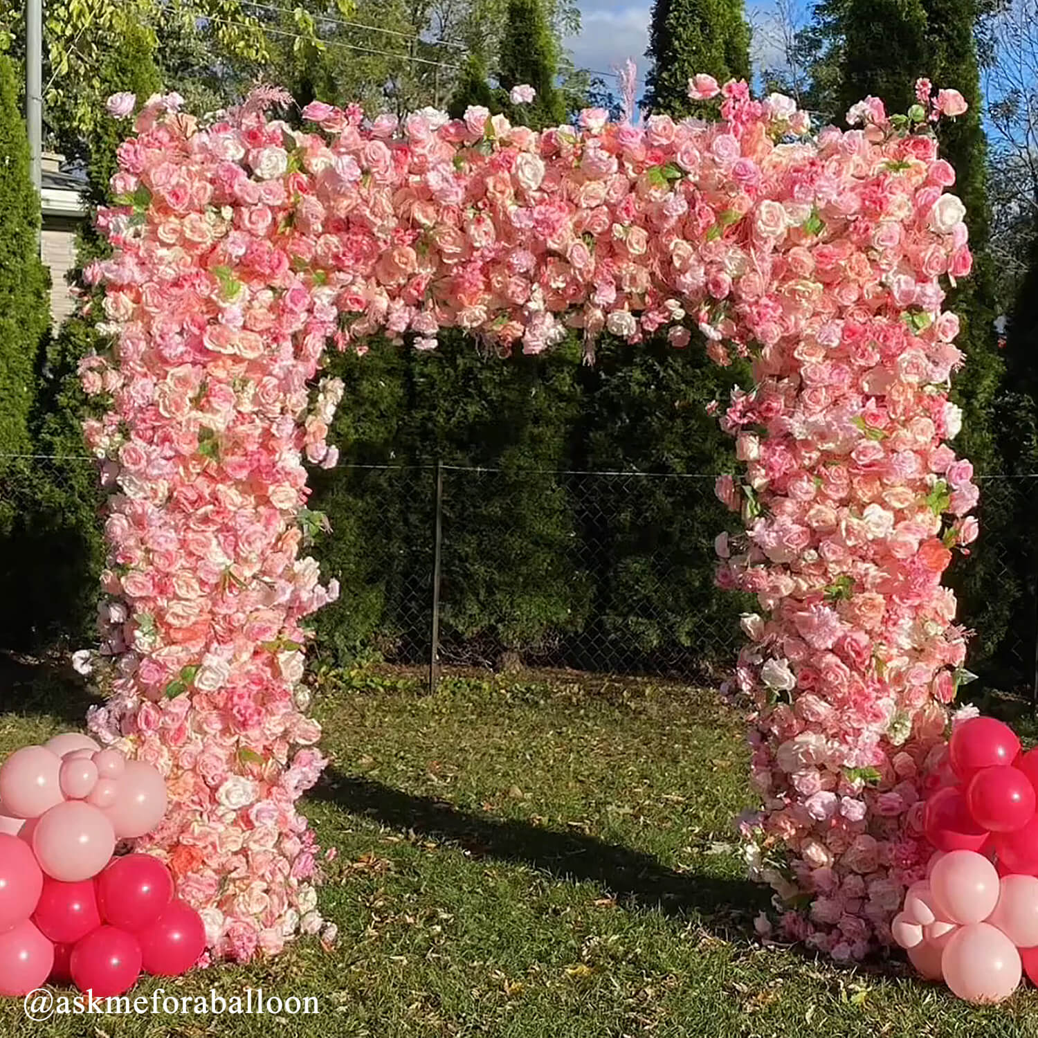 Arch Decorated With Pink Flowers Wedding Arches & Moongates For Hire