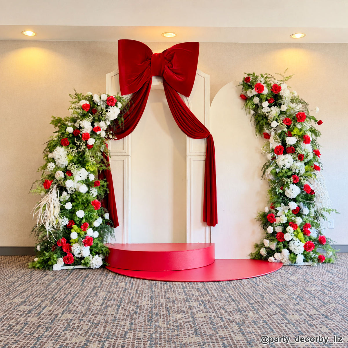Red bow floral wedding arch backdrop white rose greenery ceremony event display