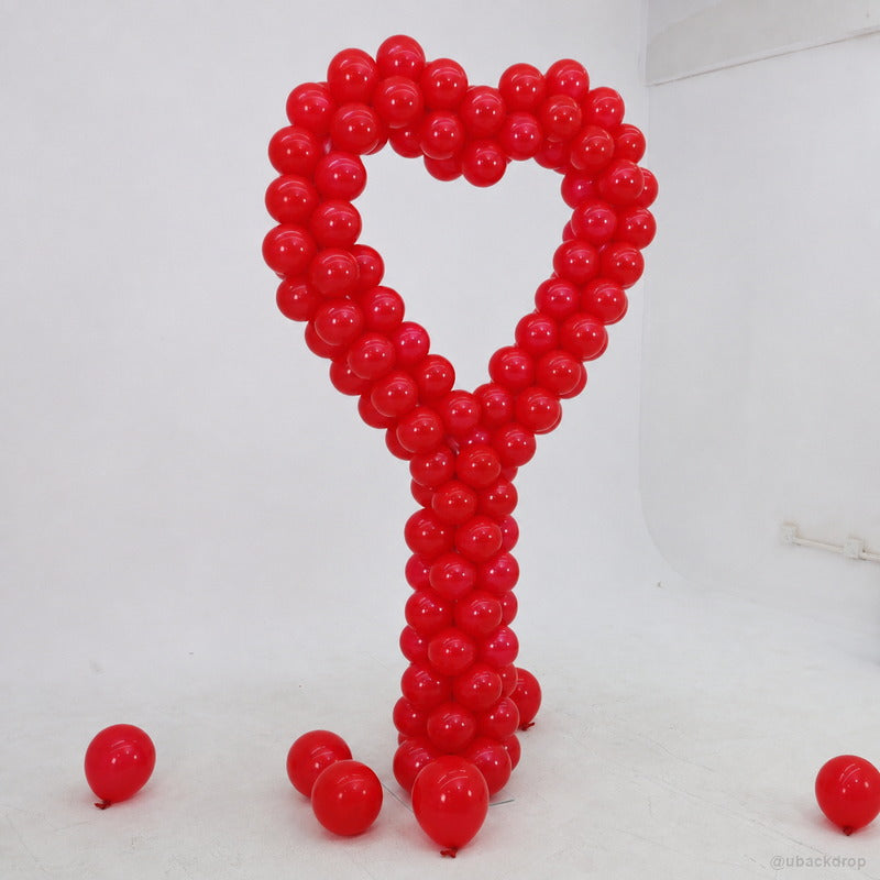 Red heart balloon column romantic event photo backdrop