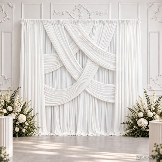White cross layered drape wedding backdrop with flowers