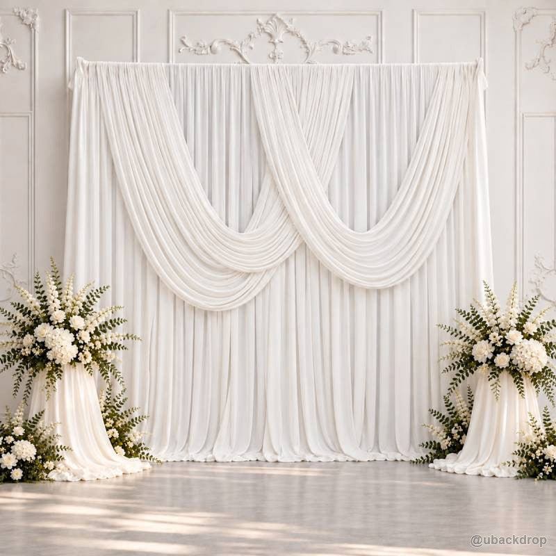 White double swag wedding drape backdrop with floral side displays 10x10ft
