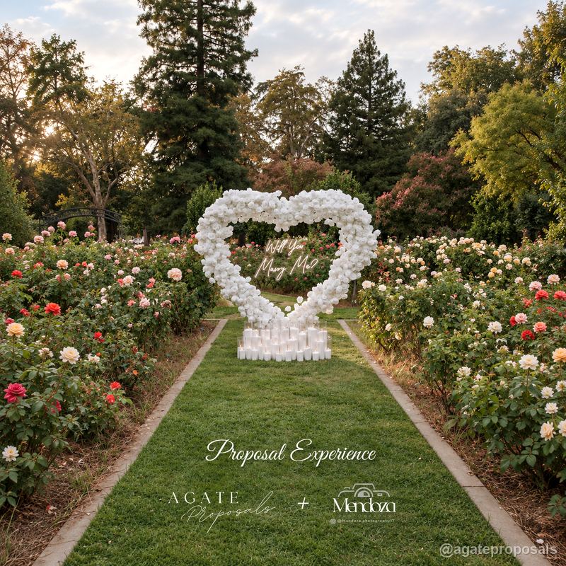 White floral heart proposal arch rose garden wedding event display