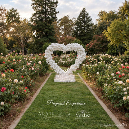 White floral heart proposal arch rose garden wedding event display