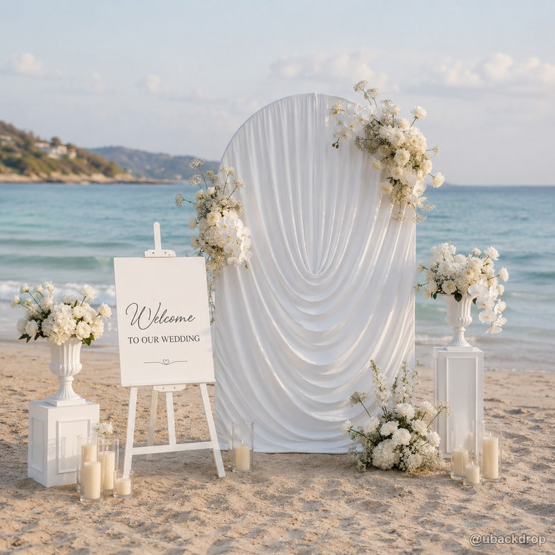White ruched fabric arch beach wedding party stand backdrop