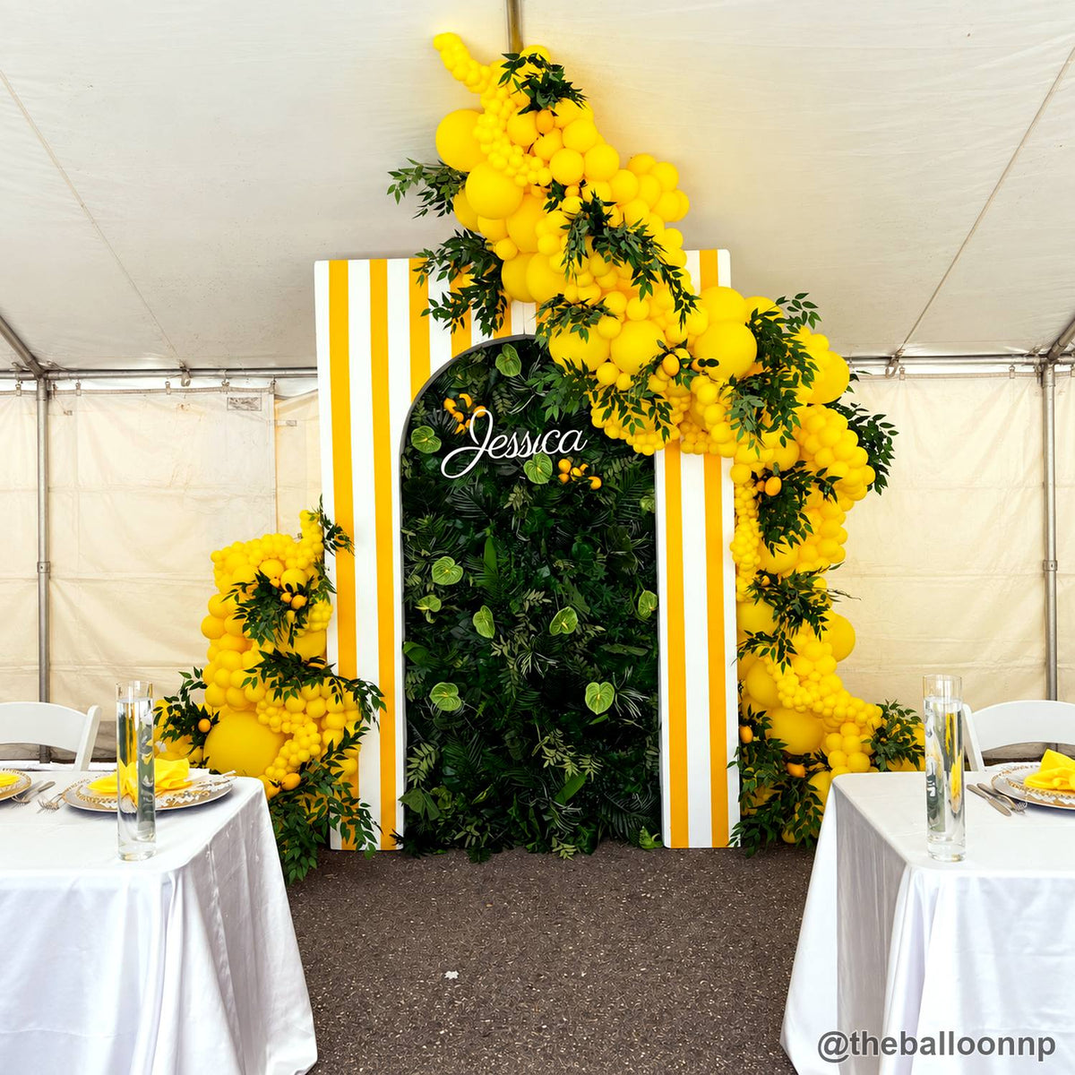 Yellow balloon green flower wall event table backdrop